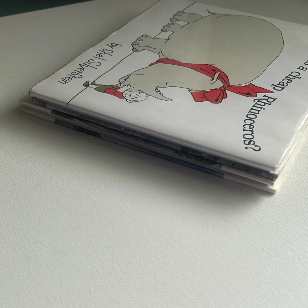 Set of 2 Where the Wild things Are Book & Who wants a cheap rhinoceros Hardback